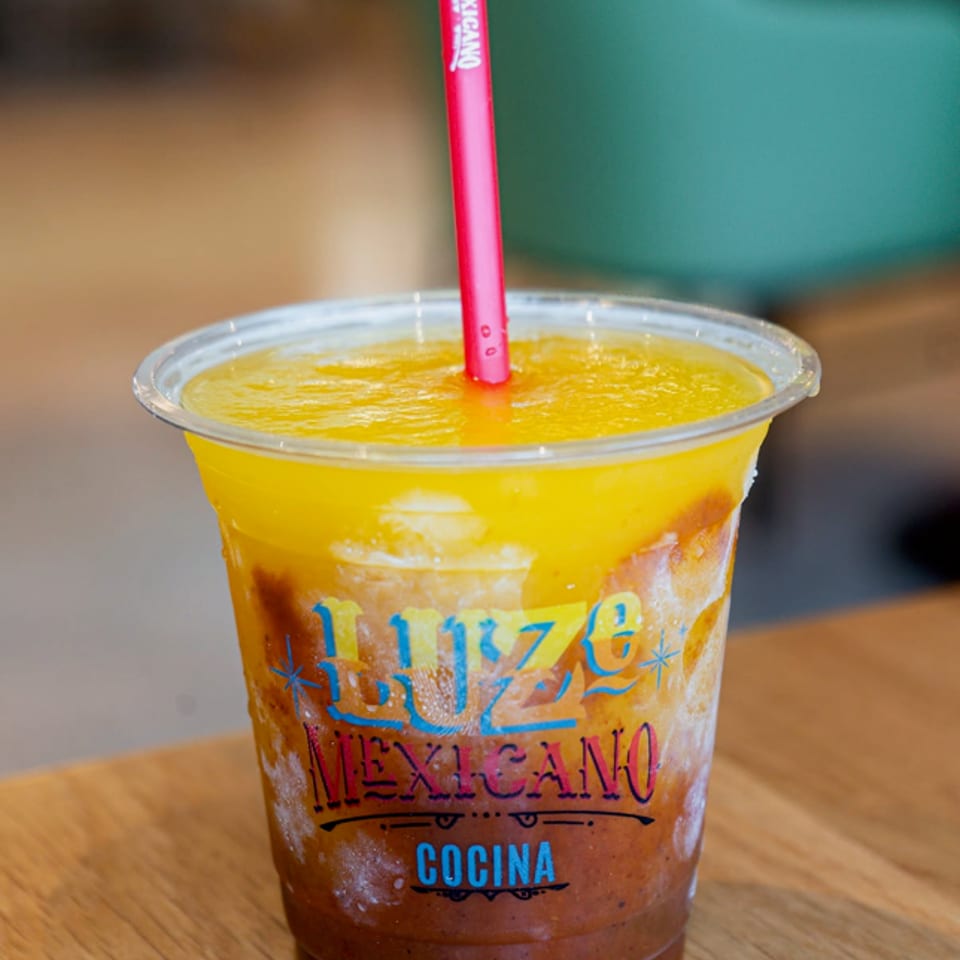 Mango passion fruit margarita in a Luze Mexicano cup